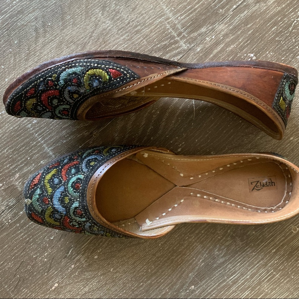 Zebidah black slip-ons with multicolor detailing